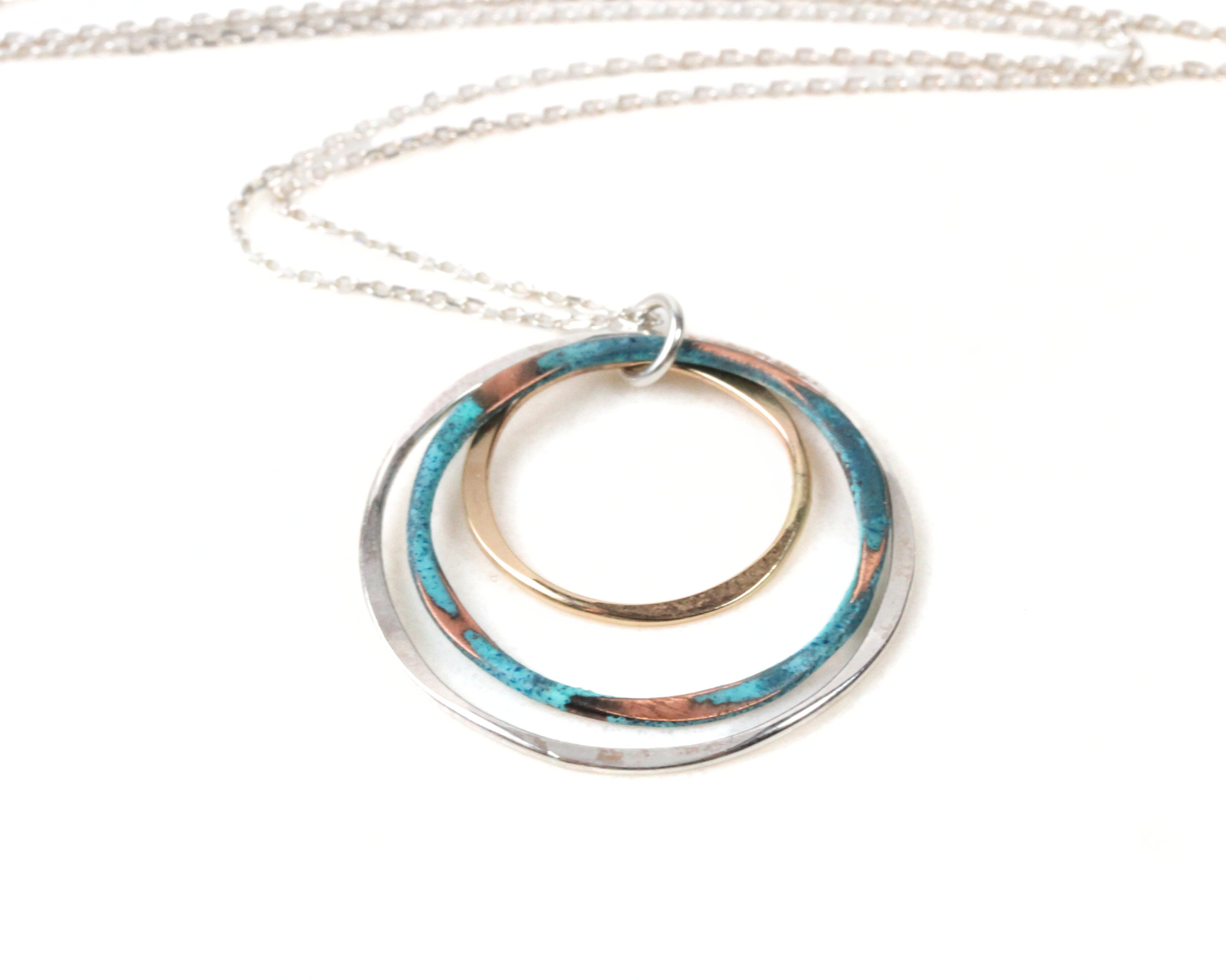 This design is lightweight and highly wearable. The mixed metal composition compliments any ensemble and the Mint patina offers an eye-catching surprise. This lively & luxurious mixed metal necklace is destined to become an instant everyday favorite
