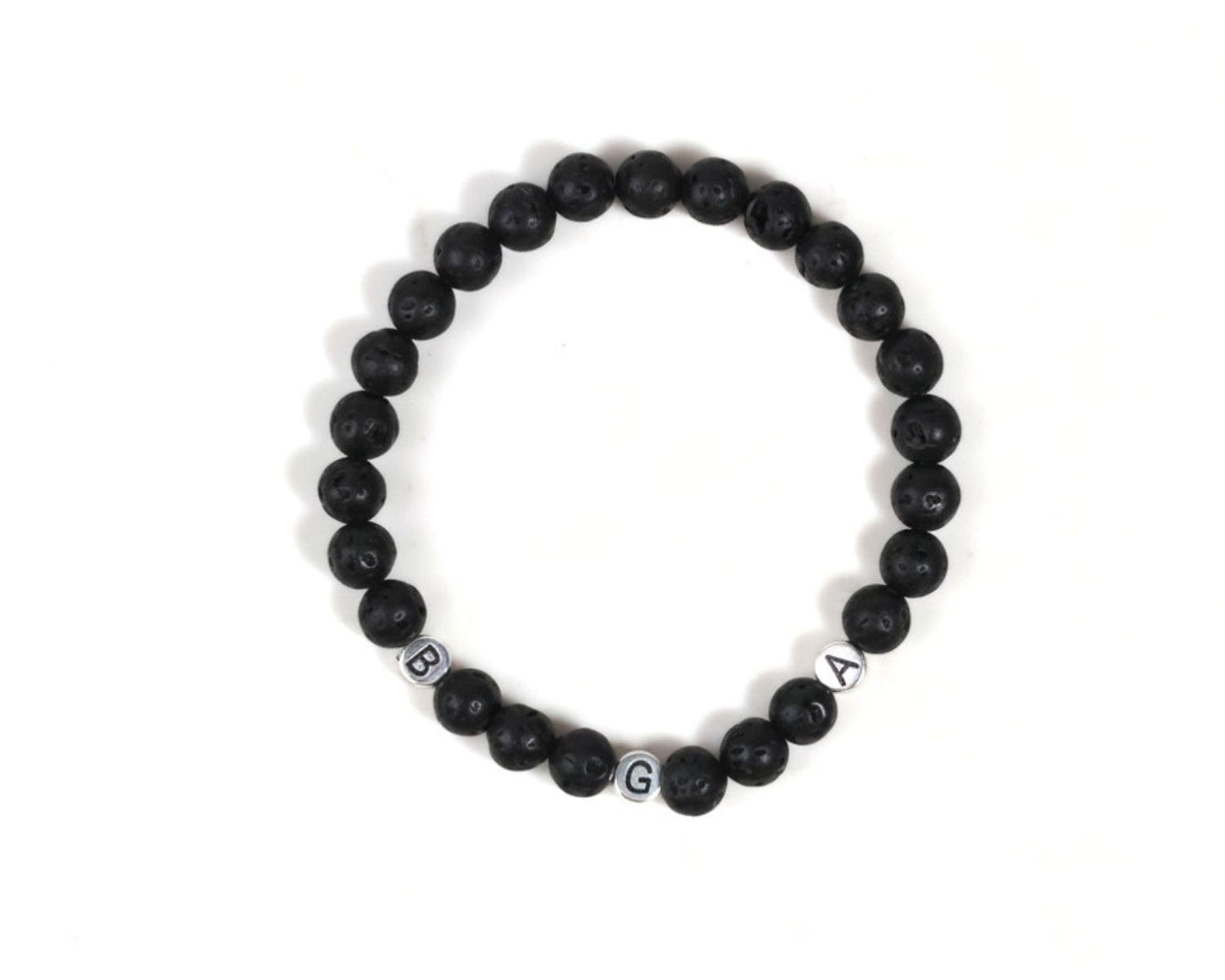A bracelet made of black beads arranged in a circular pattern.