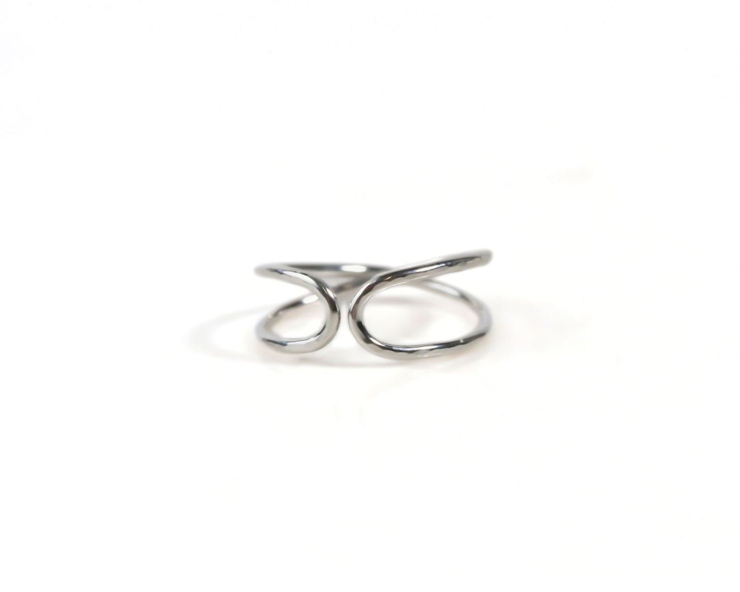 A silver ring with a twisted, coiled design.