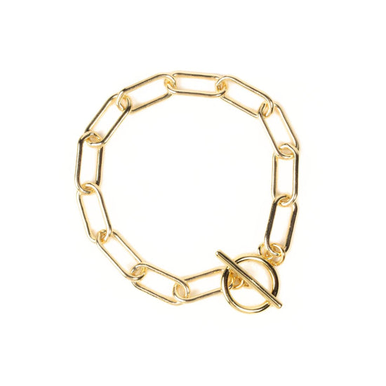 A gold-colored chain bracelet with a round clasp.