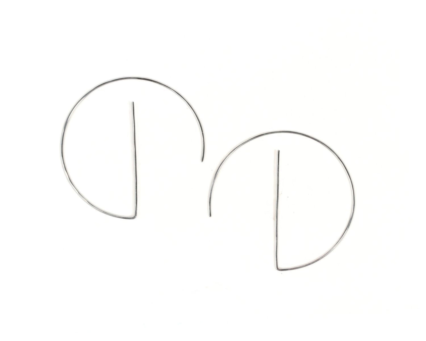 A pair of silver hoop earrings with a simple, minimalist design.
