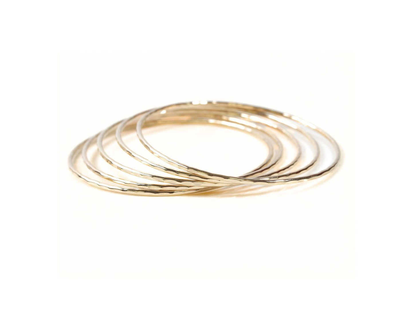 A group of gold-colored rings stacked together.