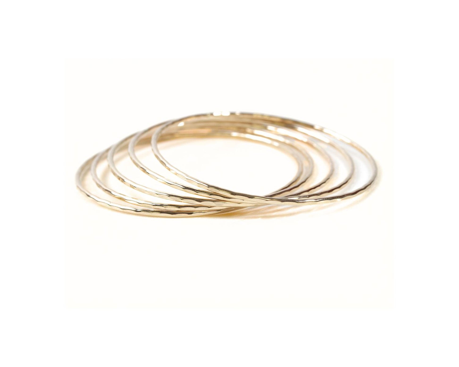 A group of gold-colored rings stacked together.