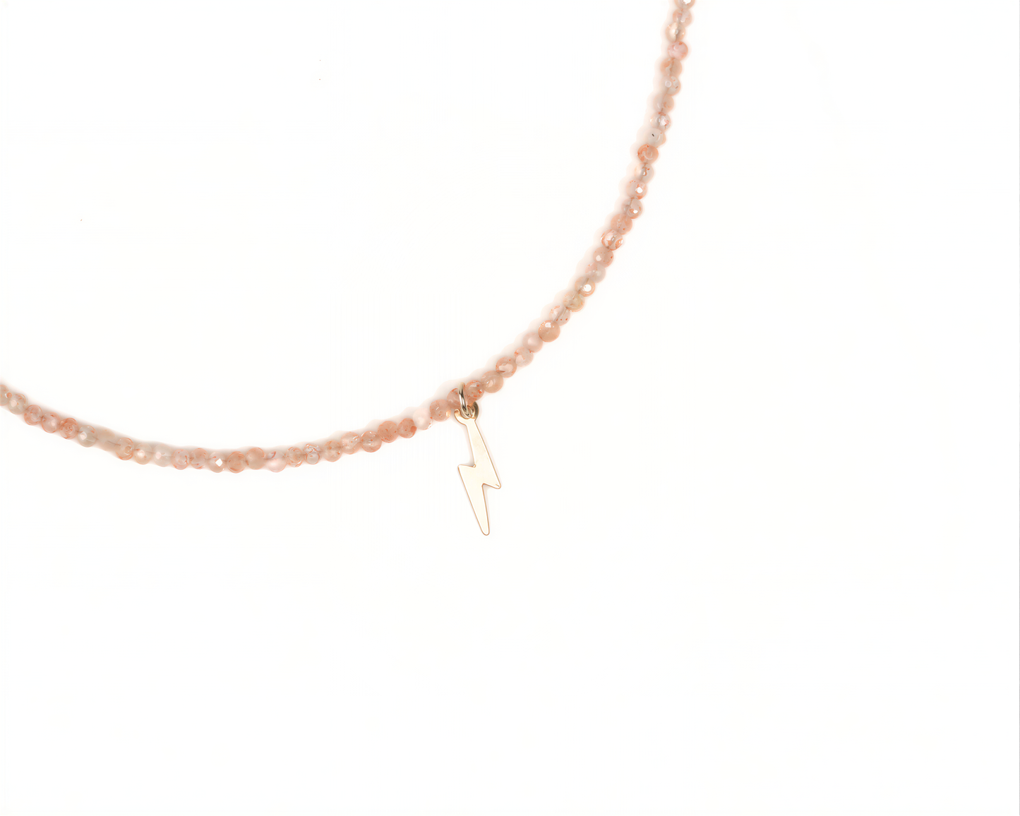 A necklace with a charm featuring a lightning bolt symbol.