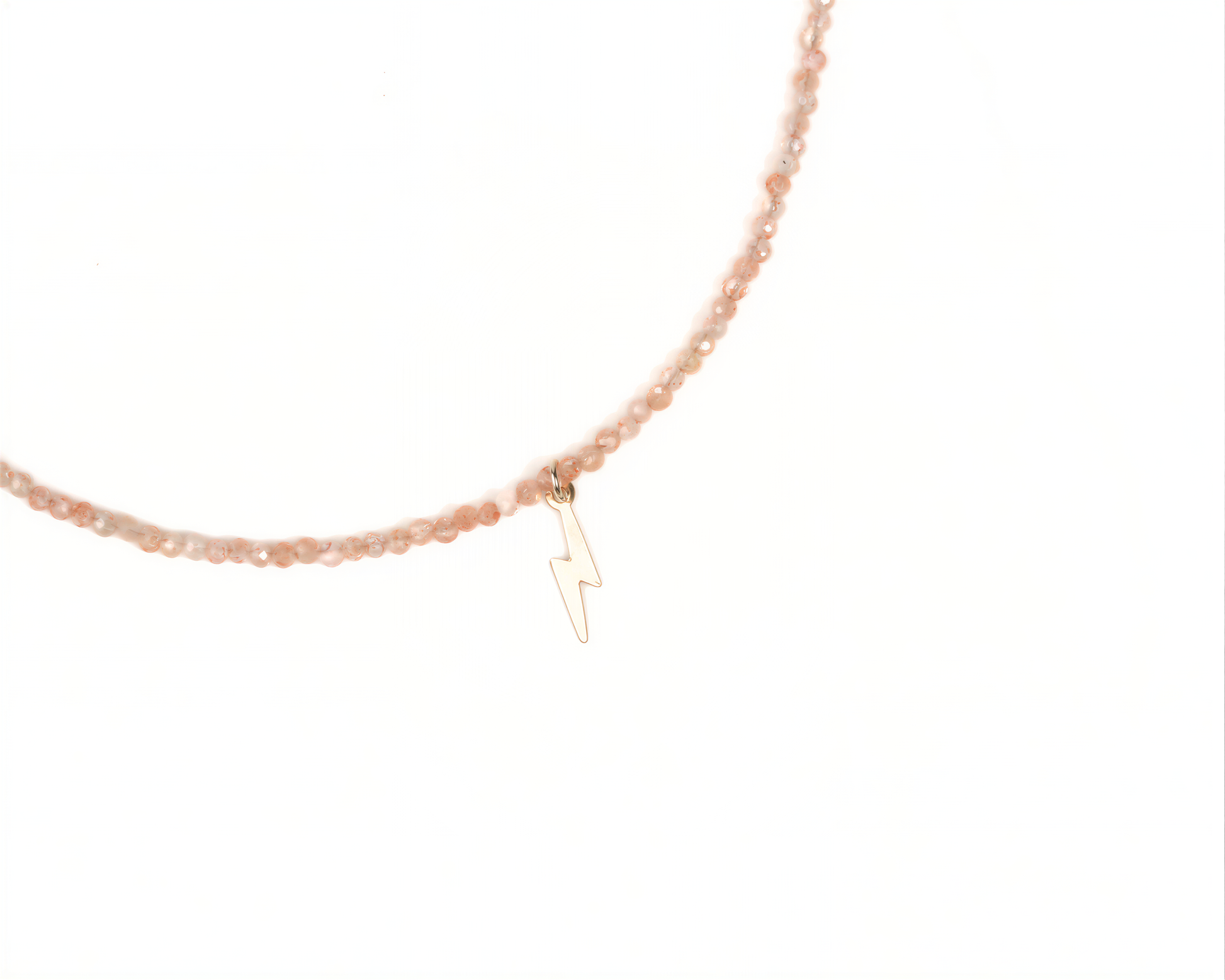 A necklace with a charm featuring a lightning bolt symbol.