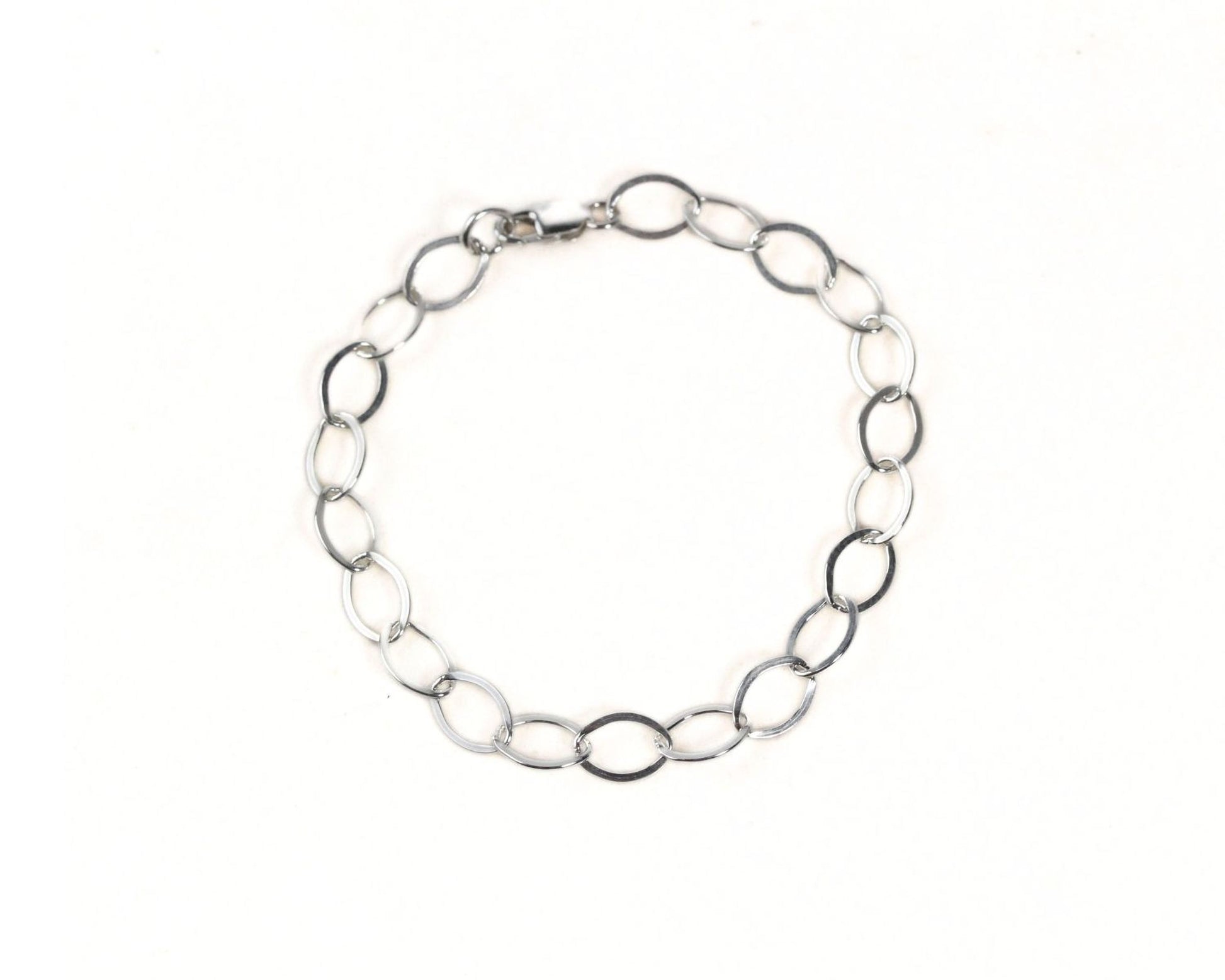 A silver chain bracelet with multiple circular links.
