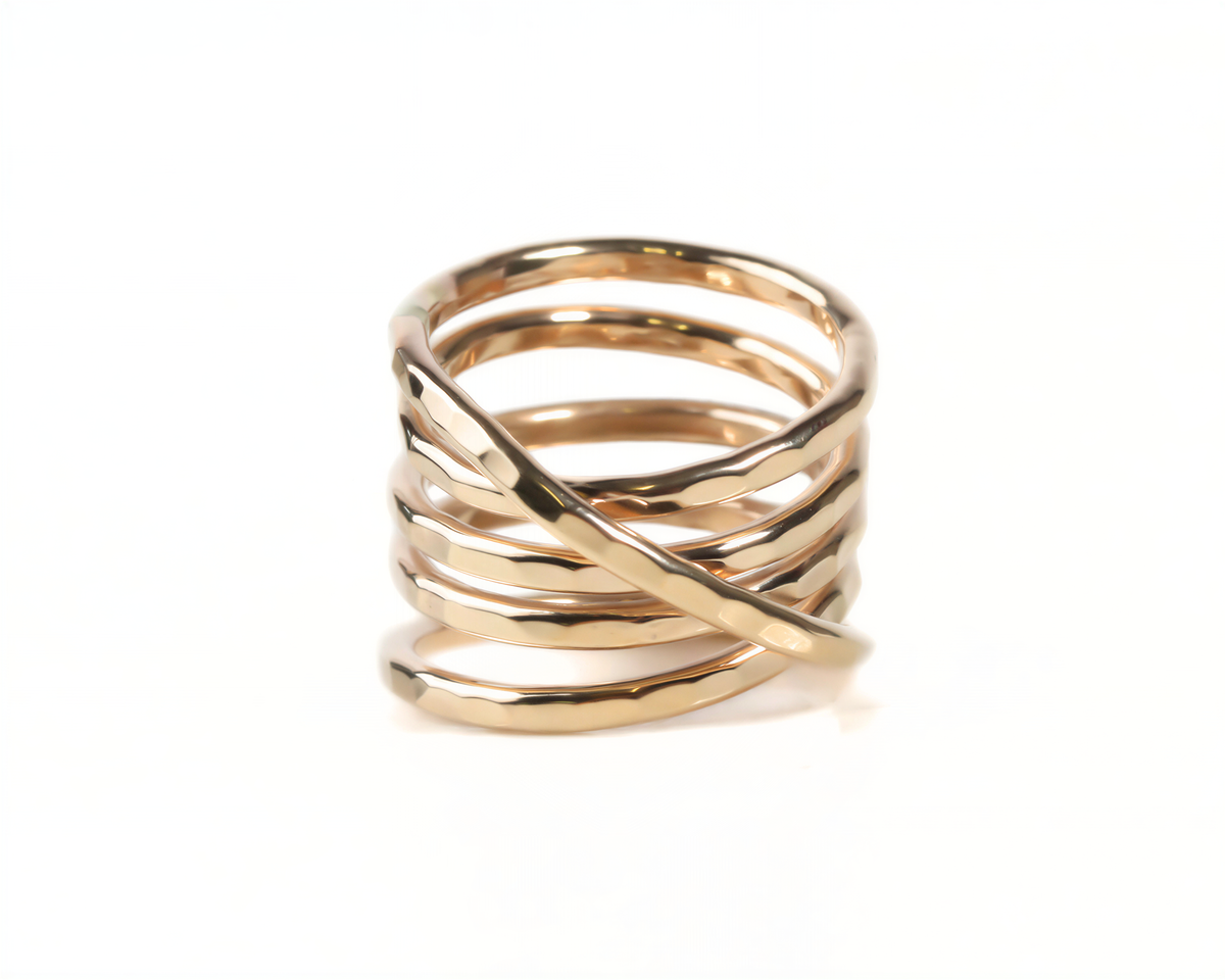 A gold ring with a twisted, coiled design.