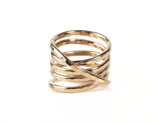 A gold ring with a twisted, coiled design.
