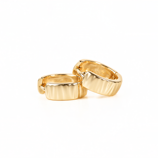 Two gold-colored earrings are shown against a white background.