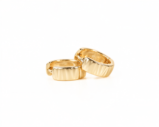 Two gold-colored earrings are shown against a white background.