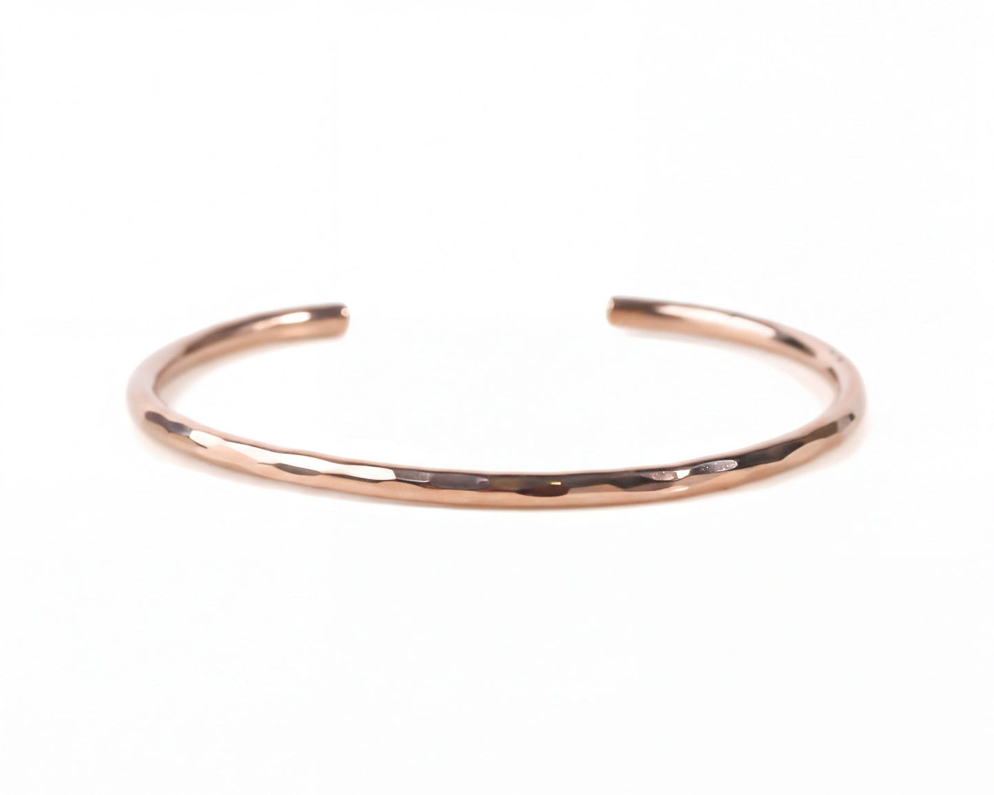 A simple, solid-colored bracelet made of a shiny, metallic material.