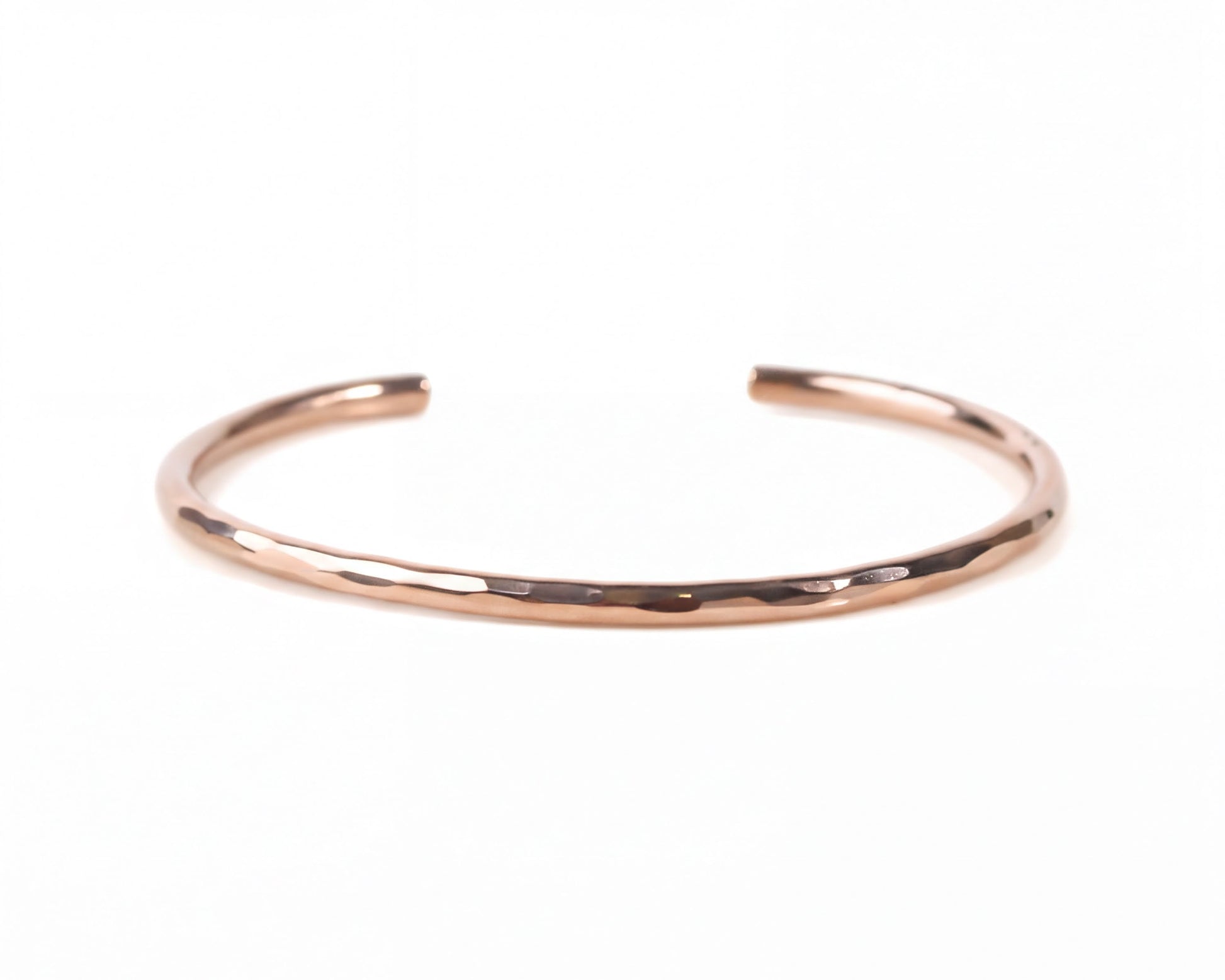 A simple, solid-colored bracelet made of a shiny, metallic material.