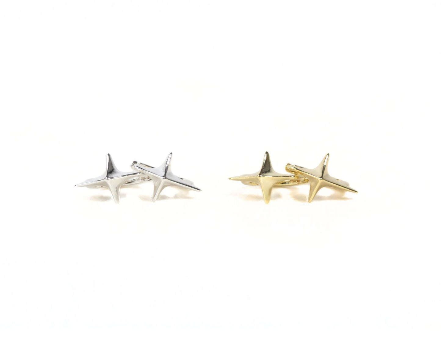 two pairs of star-shaped cufflinks, one in silver and one in gold, arranged side by side against a white background.