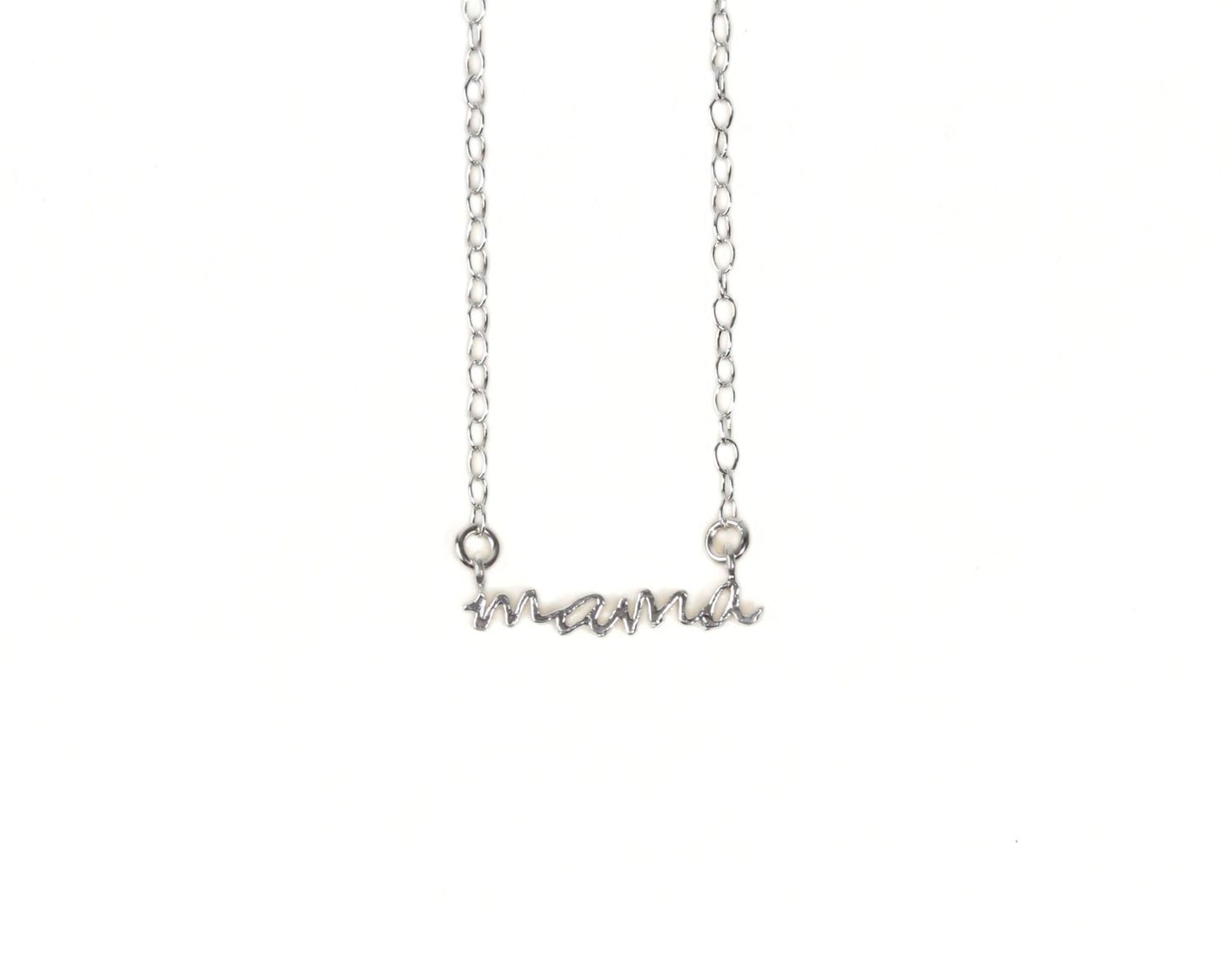 A silver necklace with the word "mama" engraved on it.