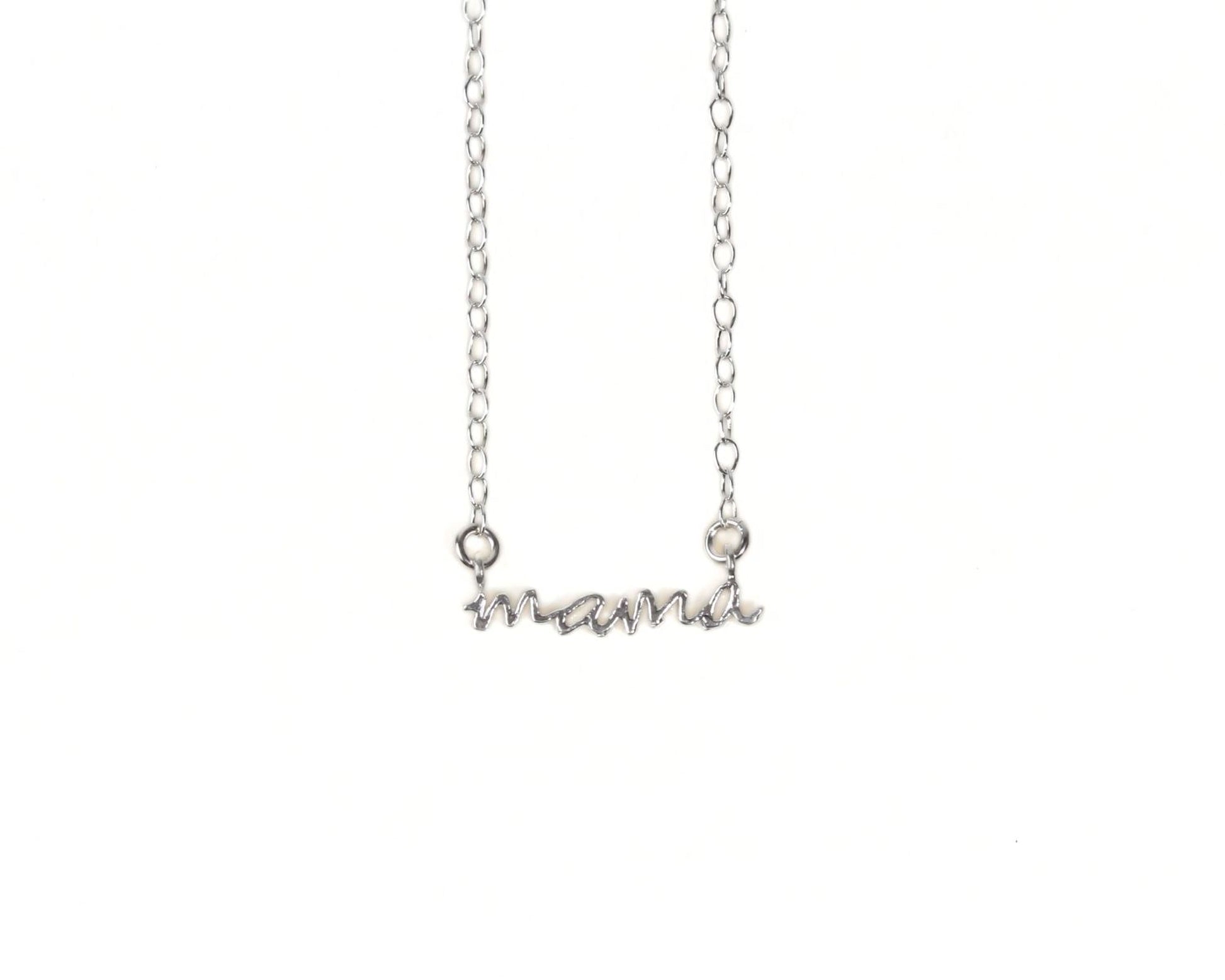 A silver necklace with the word "mama" engraved on it.