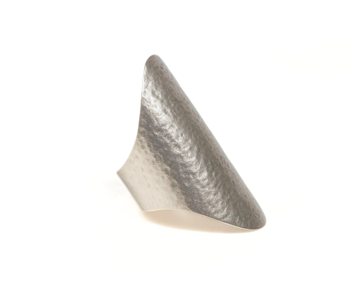 A silver ring with a textured surface and a pointed shape.