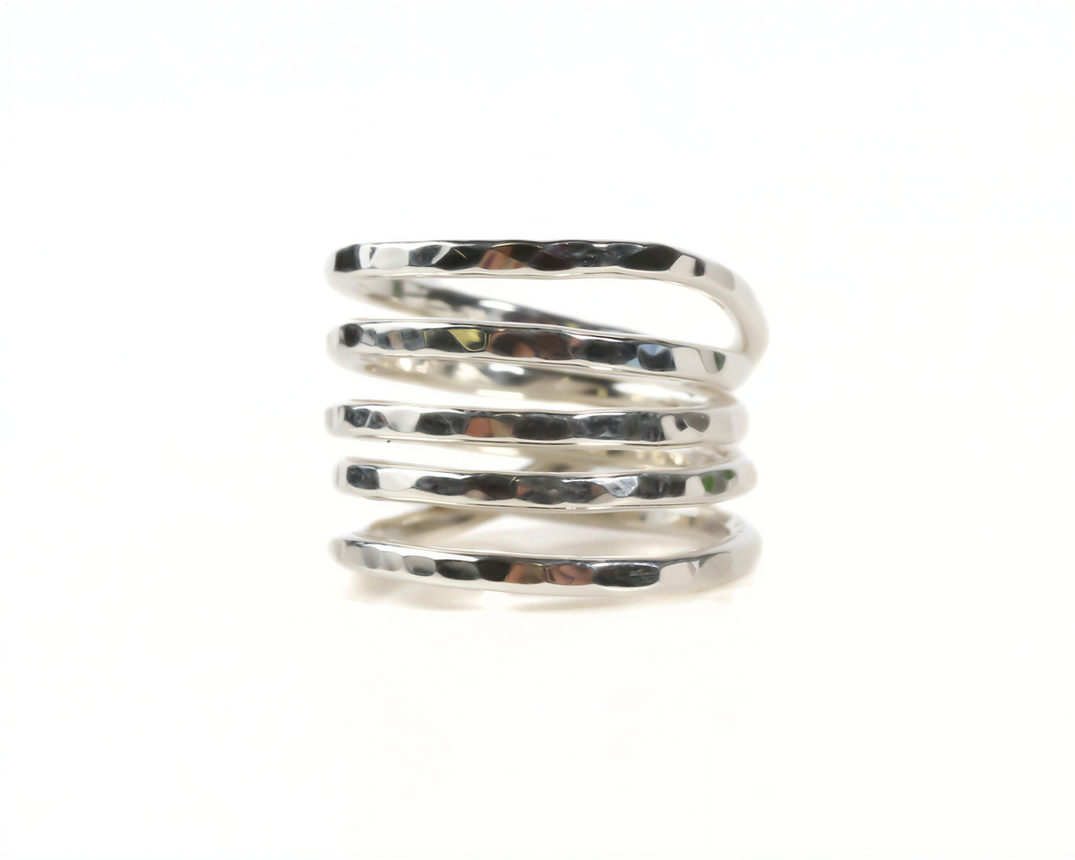 A silver ring with a spiral design, featuring multiple concentric rings.