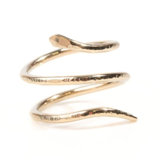 A gold-colored ring in the shape of a coiled snake.