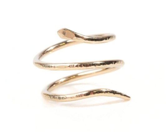 A gold-colored ring in the shape of a coiled snake.