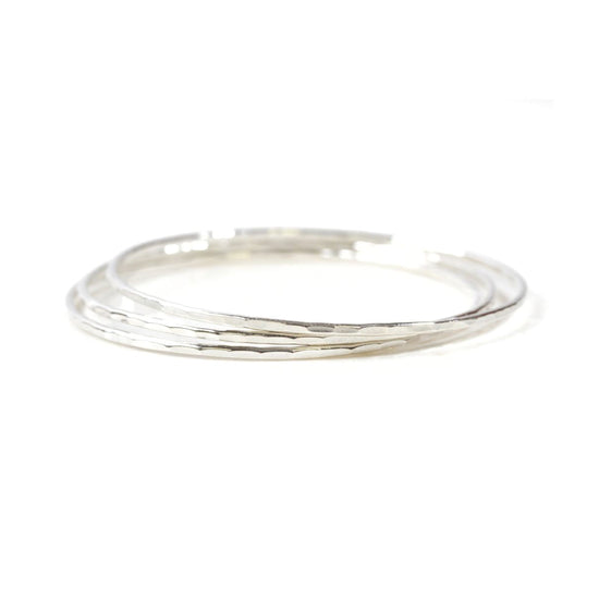 A silver ring with a textured band.