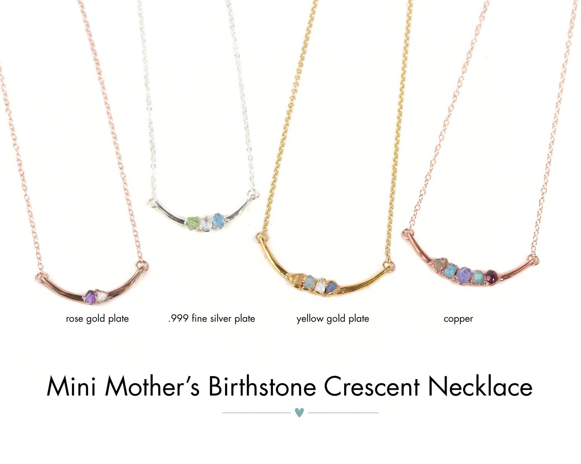 four necklaces with different colored gemstones, each with a unique design and color. The necklaces are arranged in a row, showcasing the variety of styles available.