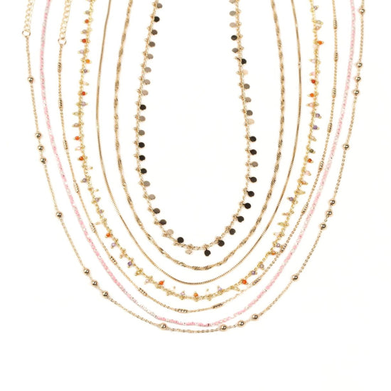 A collection of various colorful necklaces with different bead and gemstone designs.
