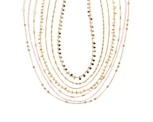 A collection of various colorful necklaces with different bead and gemstone designs.