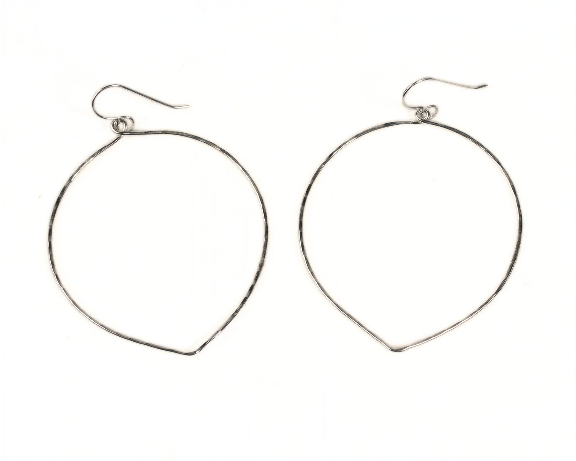 A pair of silver hoop earrings with a simple, minimalist design.