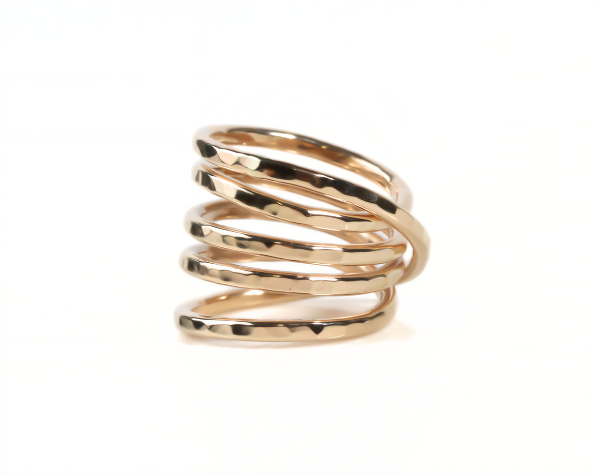A gold ring with a twisted, coiled design.