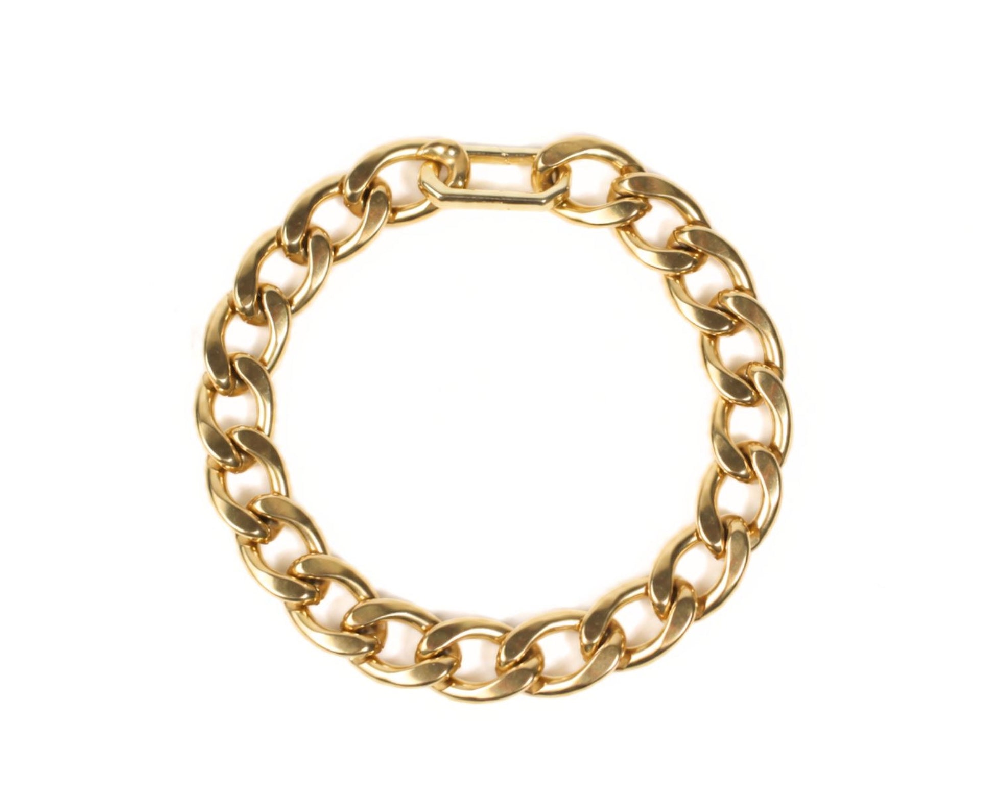 A gold-colored chain bracelet with a circular clasp.