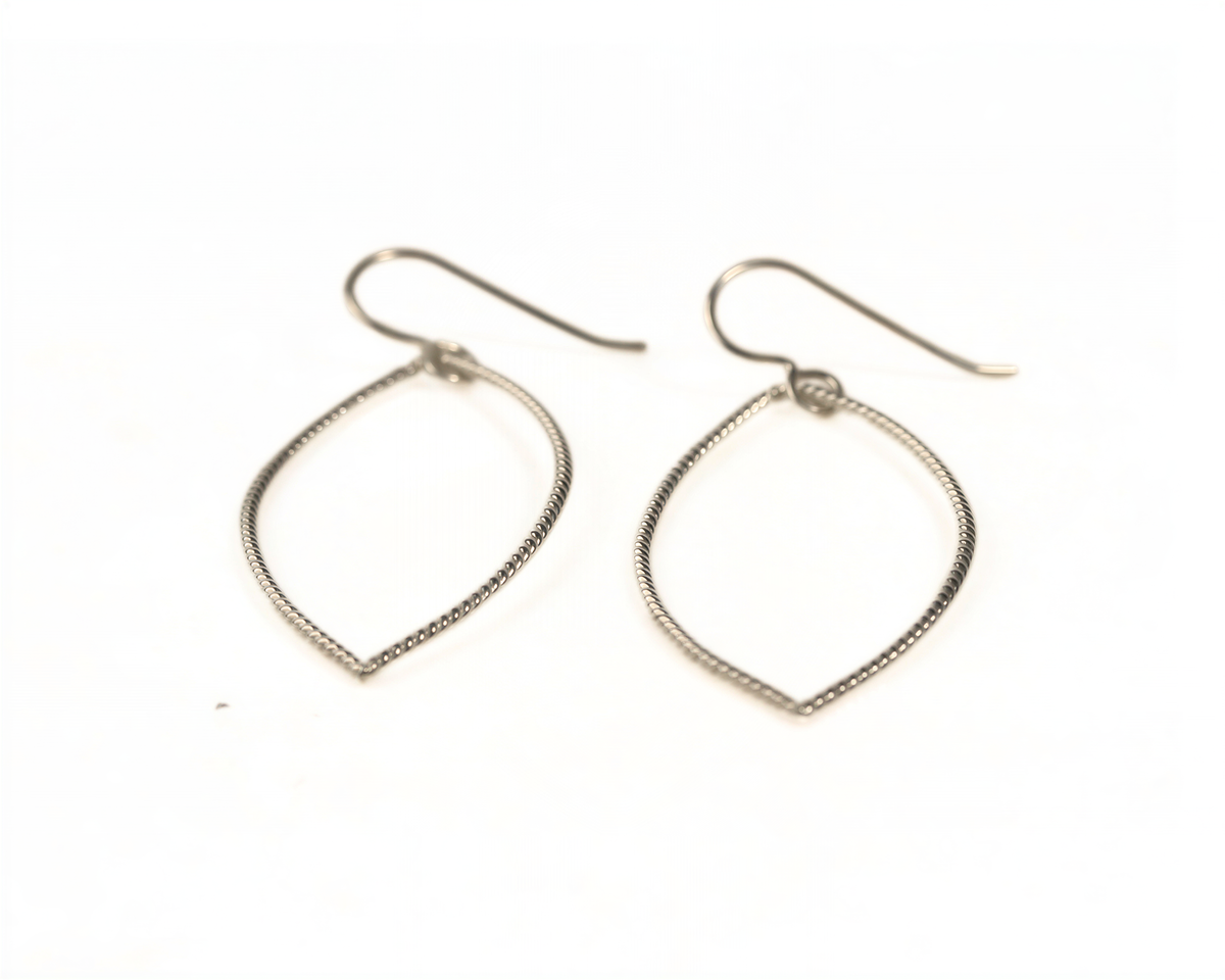 A pair of silver earrings with a leaf-shaped design.