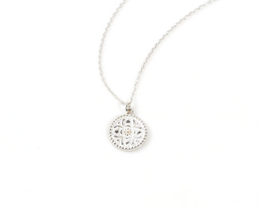 The Sterling Blossom Necklace delicately depicts the moment when a flower reaches full bloom. This fleeting phenomenon comes to life in luxurious materials and encourages you to grow, strive, and thrive. An artistic floral motif gleams from the coin.