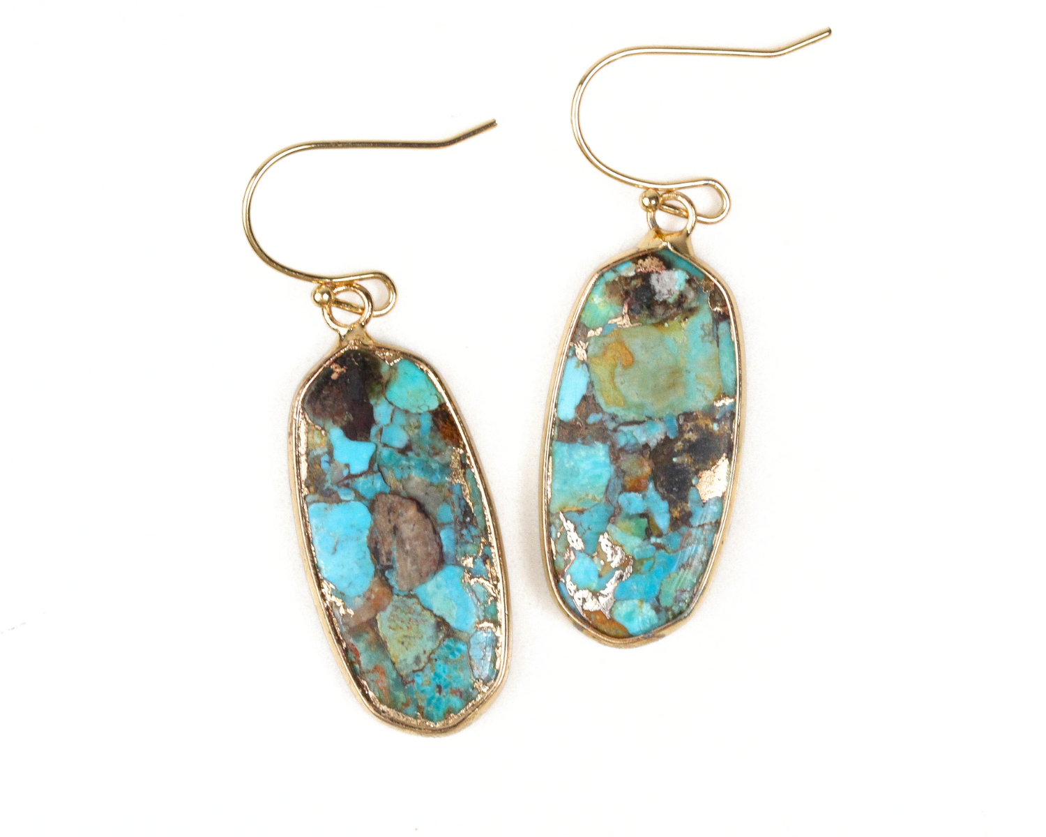 Imbued Turquoise Earrings blend earthy and elegant elements in perfect harmony. The effect is captivating. A border of the same Silver or Gold plate wraps each stone. Select Gold or Silver. Our fine metal ear wires will match your choice of metal.