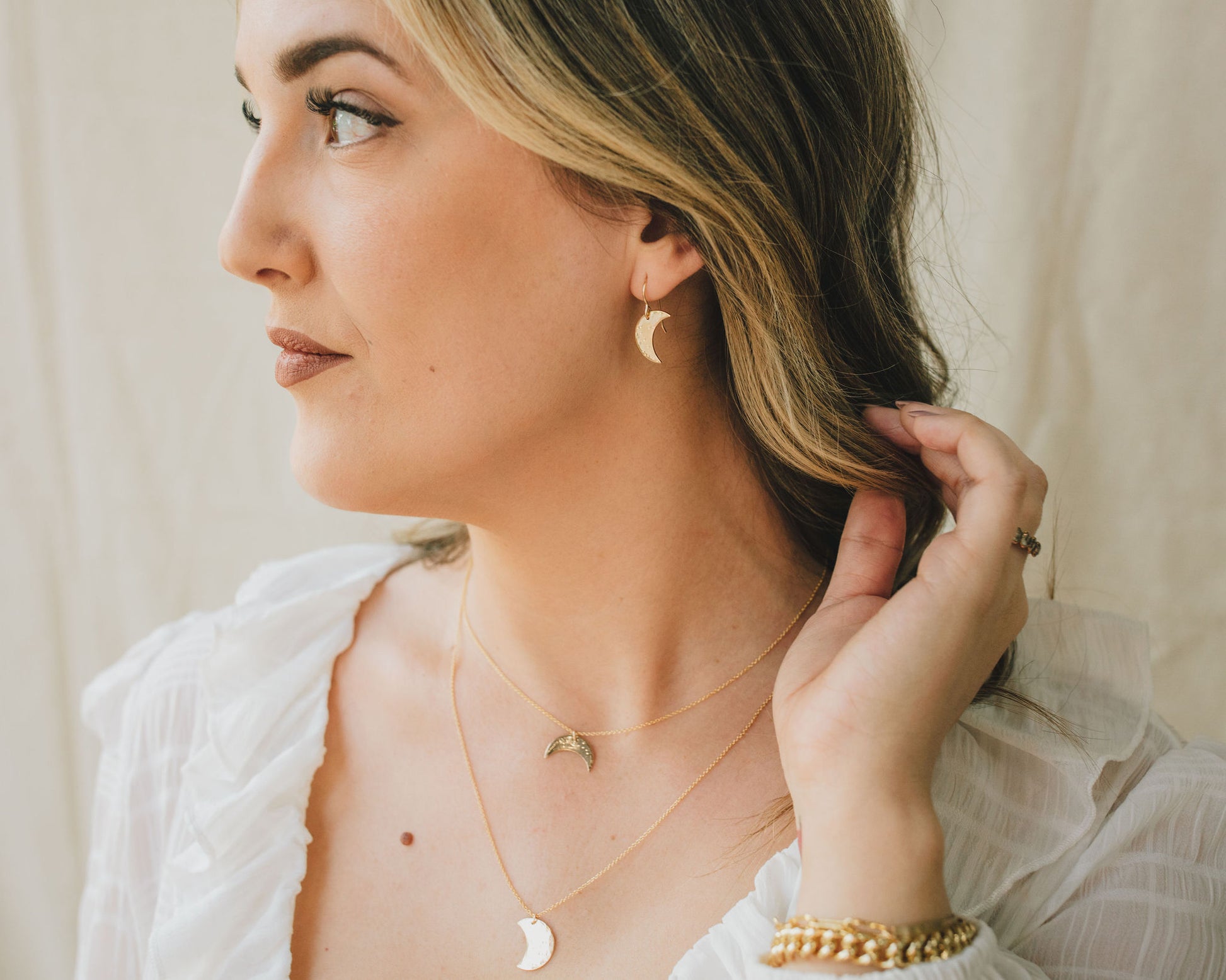 Model is wearing the 14 karat gold fill earrings and necklaces. Share these meaningful celestial treasures with your BFF crew and crystallize your cosmic connections with high quality handcrafted Wearable Love Jewelry they will wear for years to come