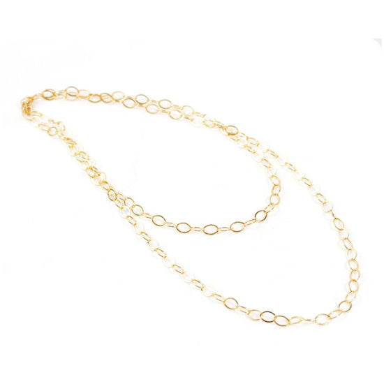 A delicate gold chain necklace with multiple circular links.