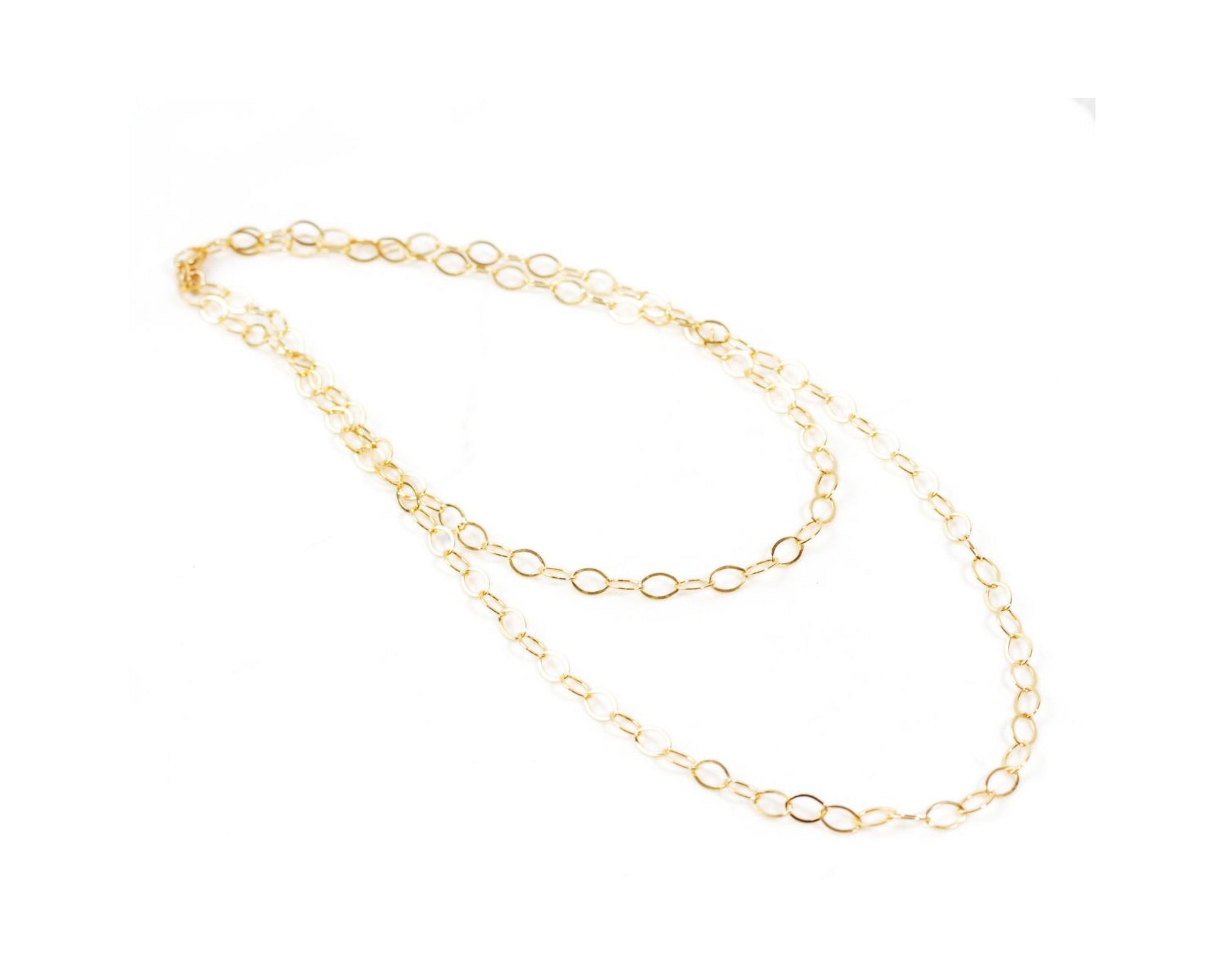 A delicate gold chain necklace with multiple circular links.