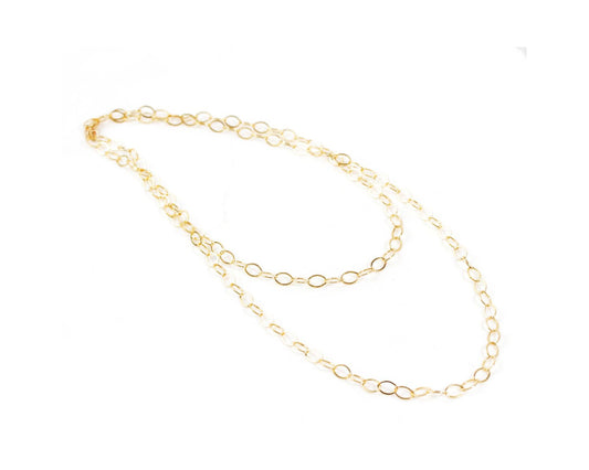 A delicate gold chain necklace with multiple circular links.