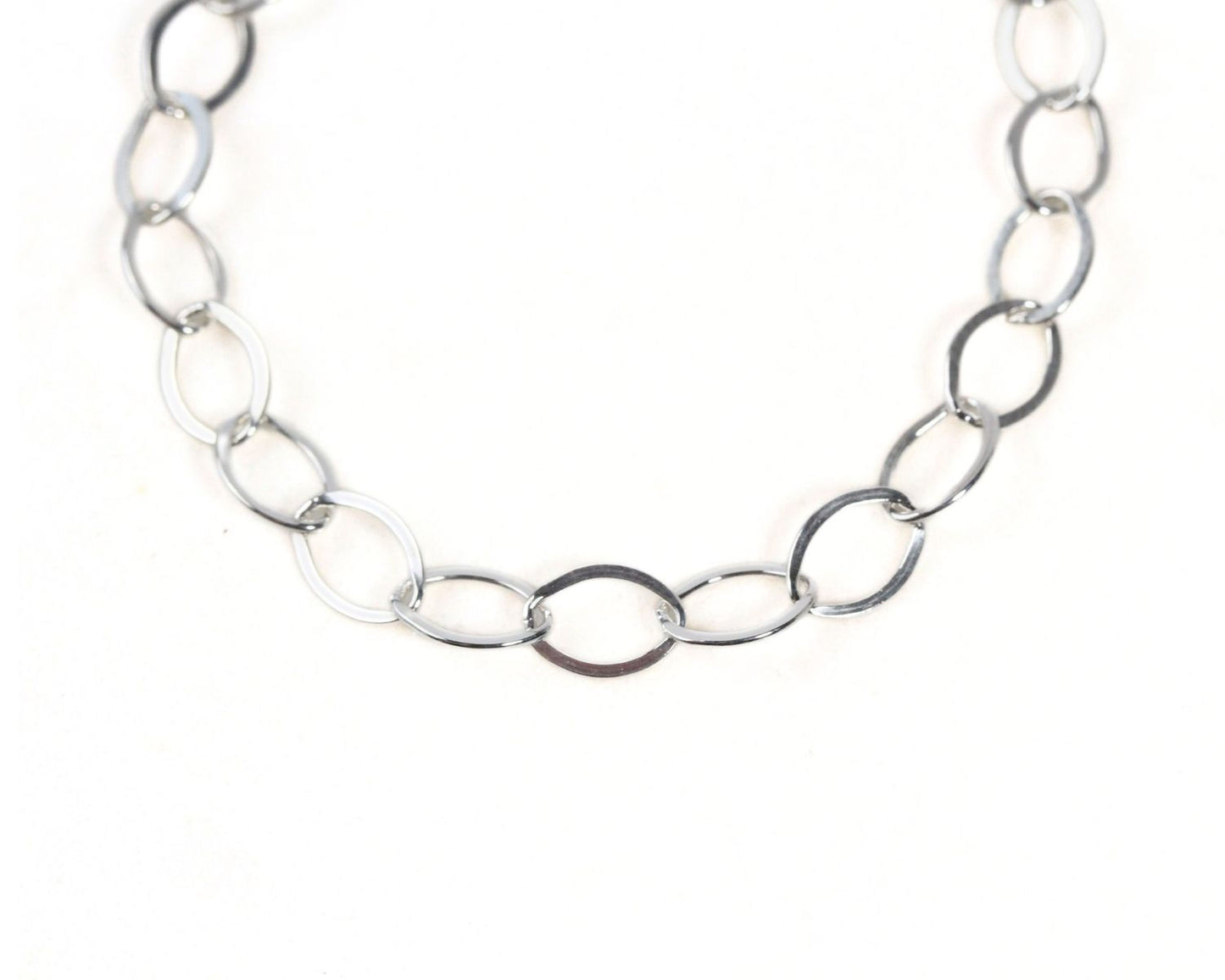 A silver chain necklace with multiple interlocking links.
