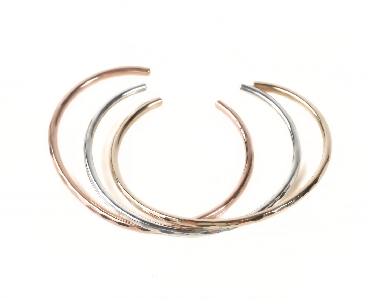 a collection of three colorful bracelets arranged in a circular pattern.