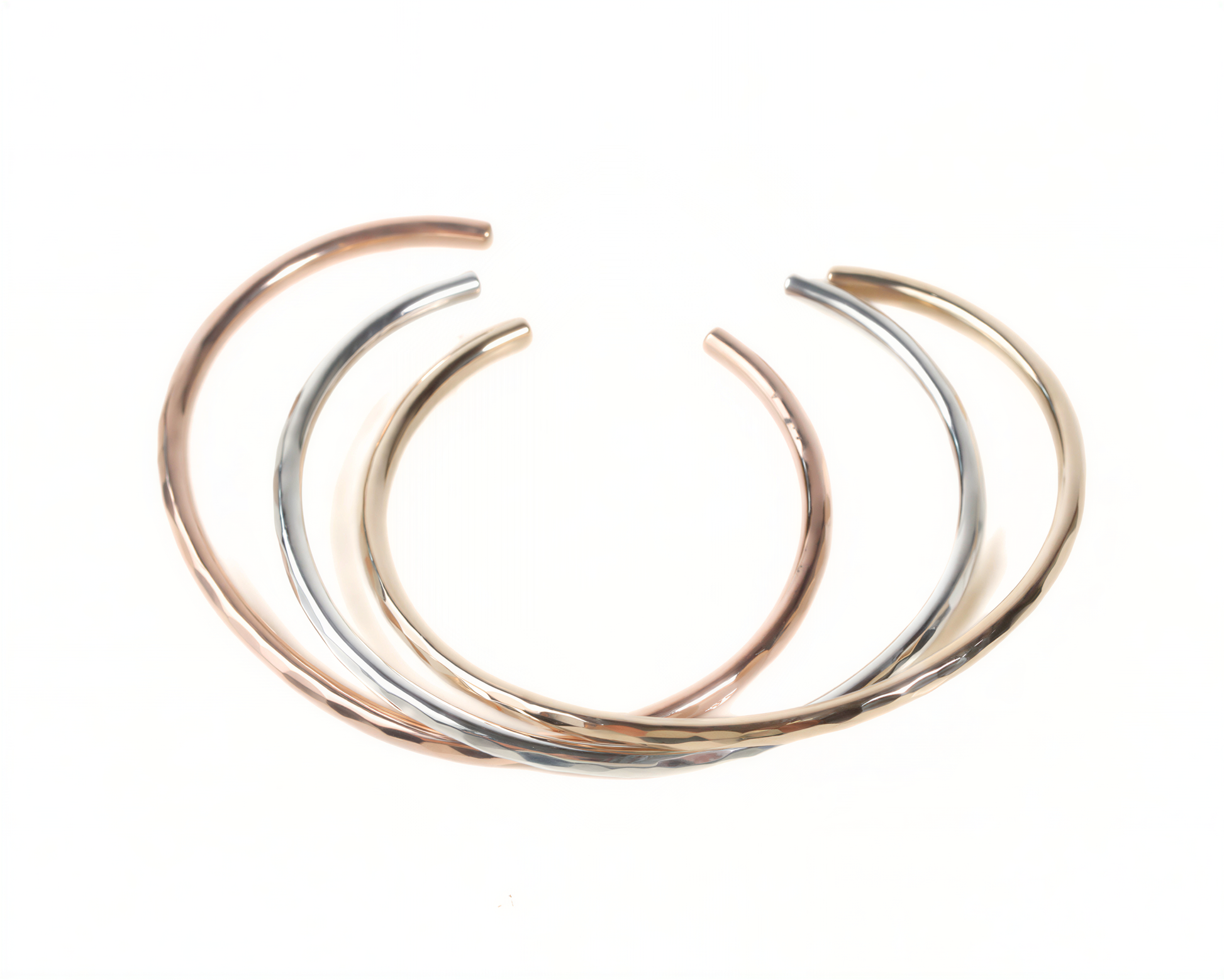 a collection of three colorful bracelets arranged in a circular pattern.