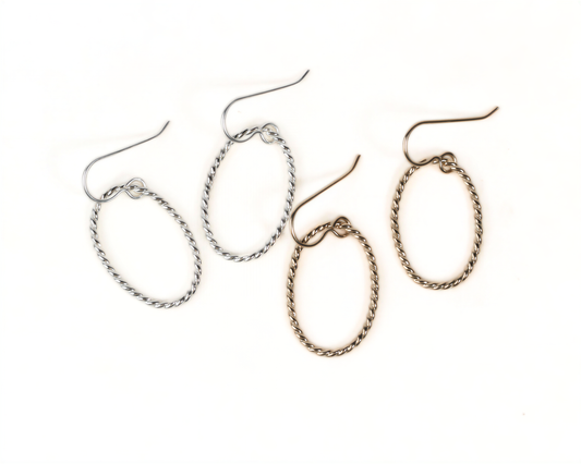 a pair of earrings with twisted metal designs, featuring two pairs of earrings in different colors.