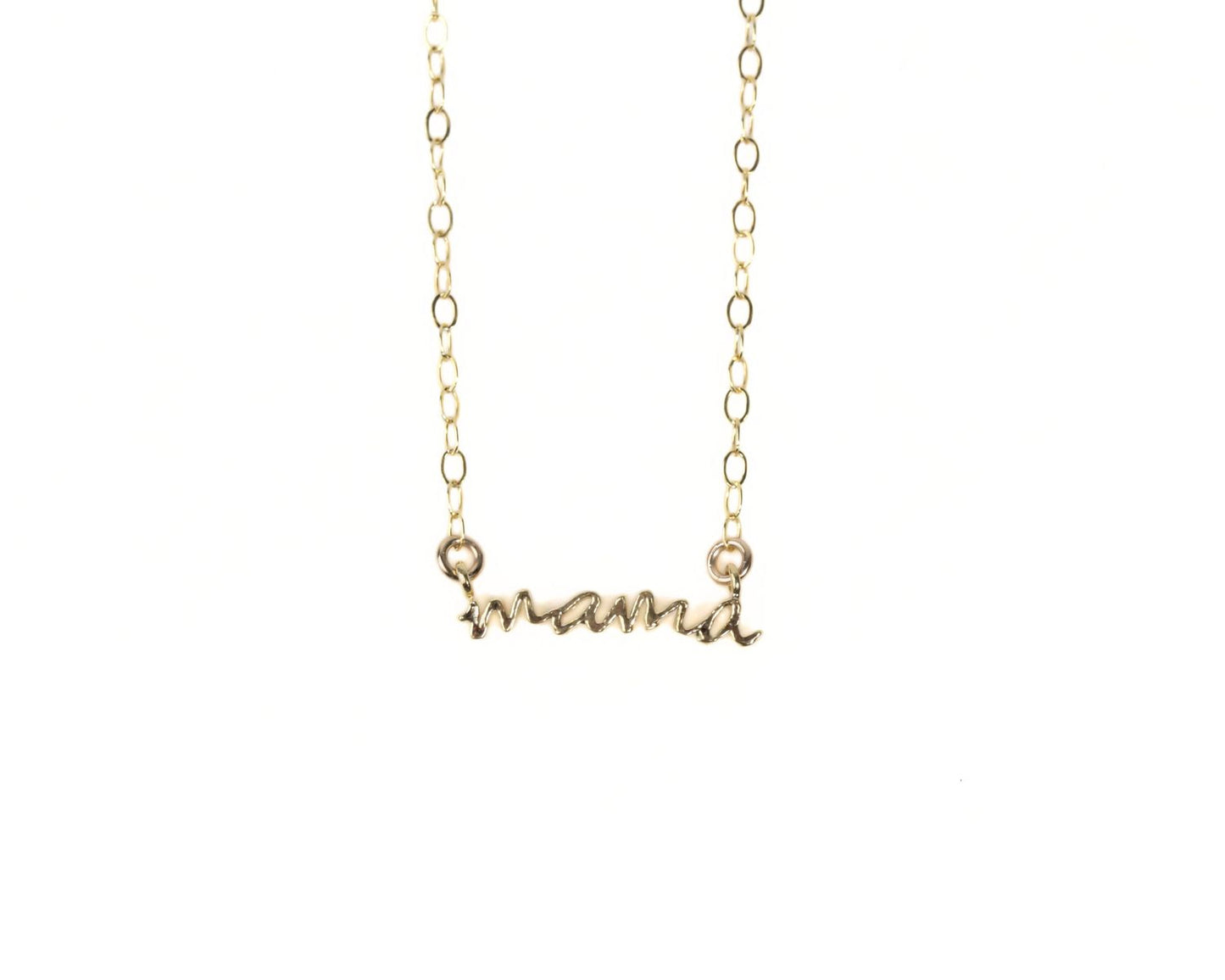 A gold-colored necklace with the word "mama" engraved on it.