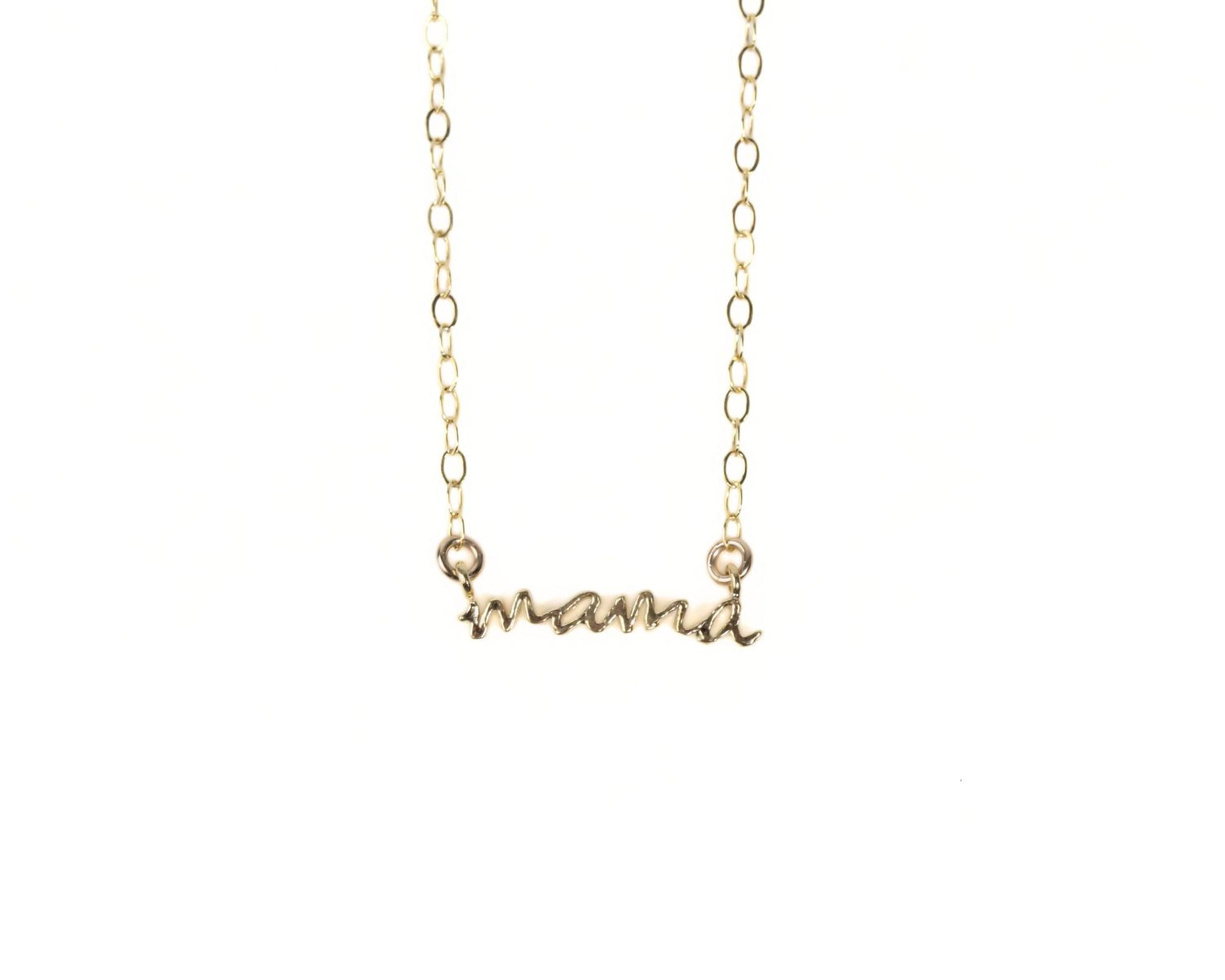 A gold-colored necklace with the word "mama" engraved on it.