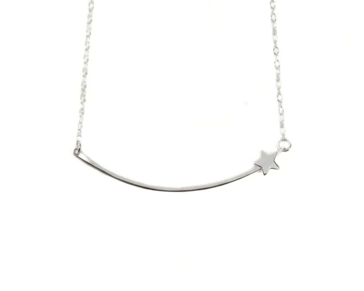 A silver necklace with a curved bar and a small star charm.