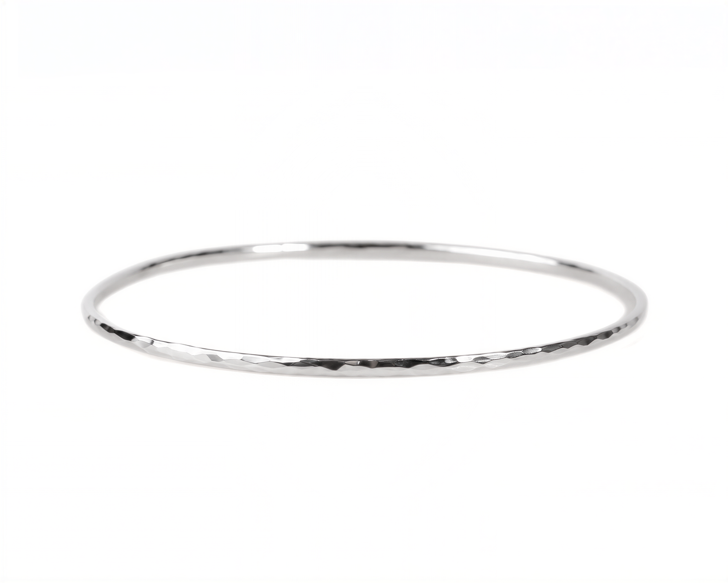 A simple silver-colored bangle bracelet is shown against a white background.
