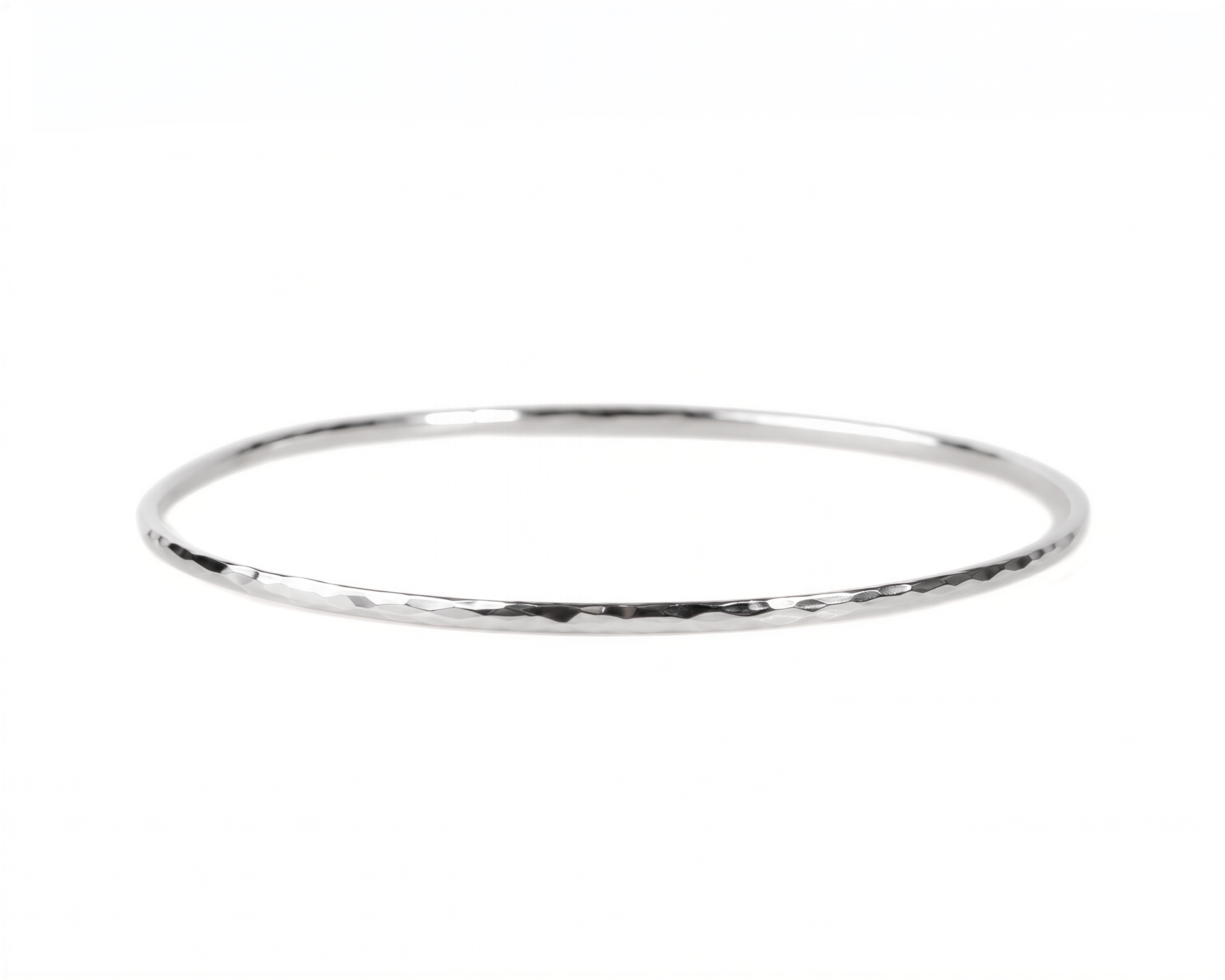 A simple silver-colored bangle bracelet is shown against a white background.