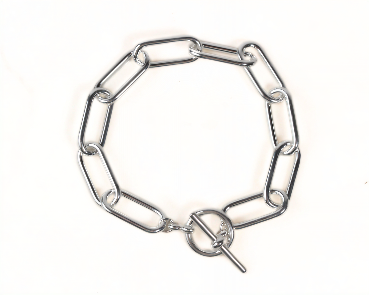 A silver-colored metal chain bracelet with multiple links and a clasp at the end.