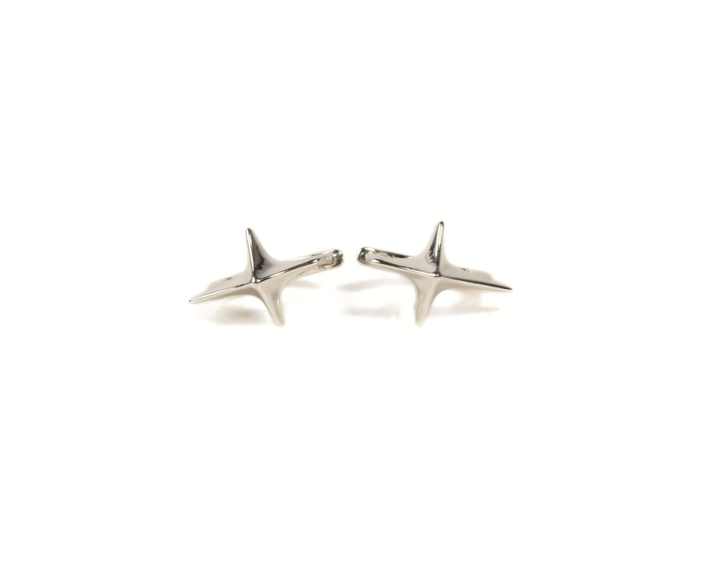 Two silver star-shaped earrings are shown against a white background.