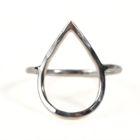 A silver ring with a unique, modern design featuring a triangular shape.
