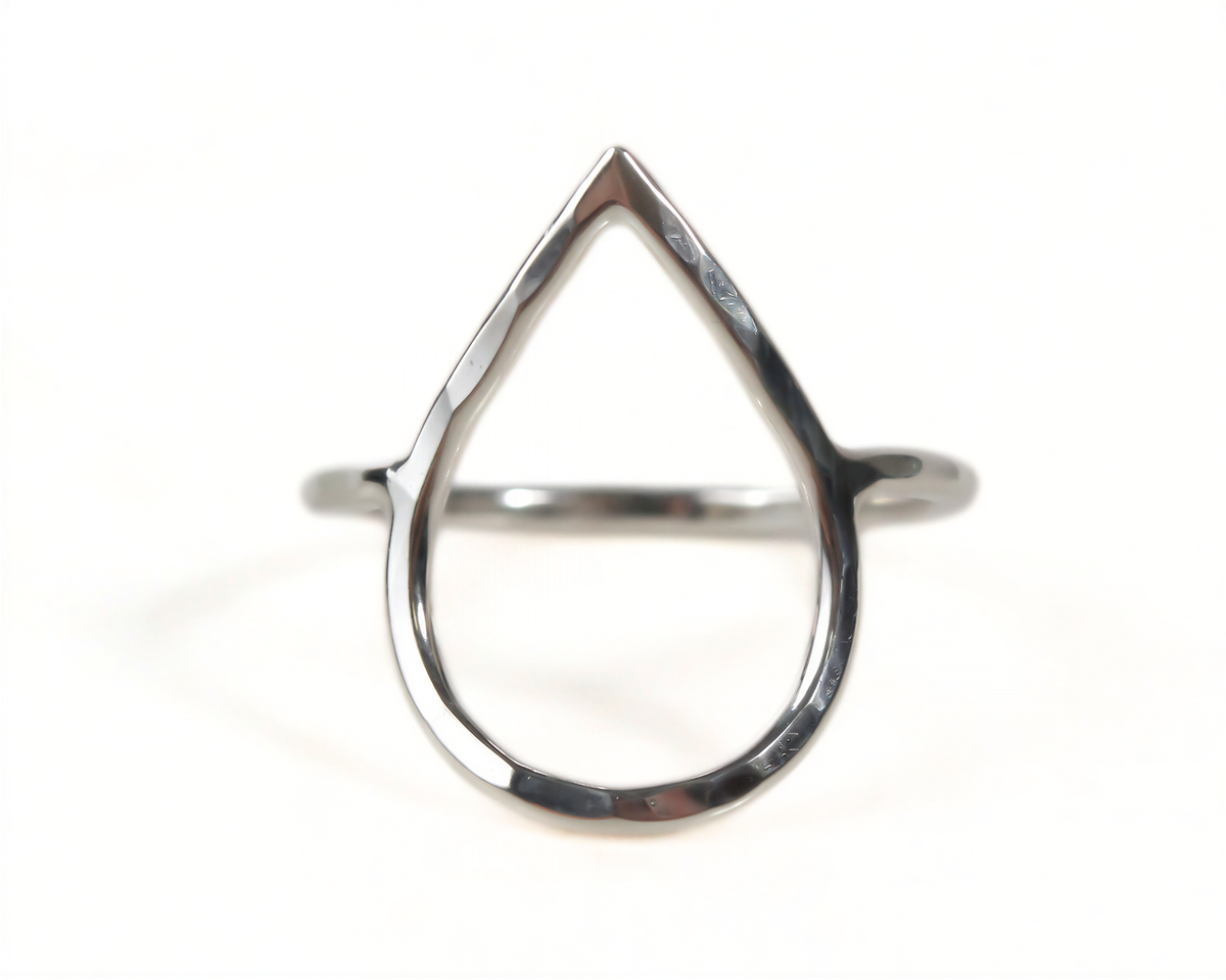 A silver ring with a unique, modern design featuring a triangular shape.